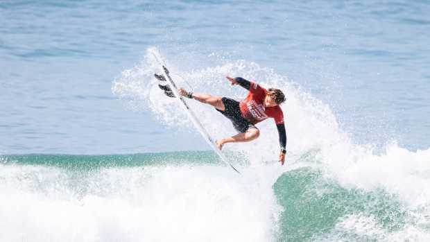 Mexican surfer Al Cleland Jr. lands an air at the US Open of Surfing in Huntington Beach.