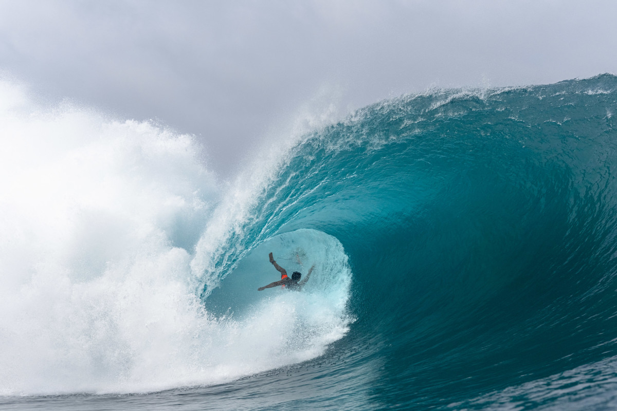 Arenui Parker was flying through this barrel before the foam ball lifted him and he went head over heels. A second after this frame, he slammed straight into the reef, ending his surf for the day and he required some assistance getting back to land to get cleaned up.