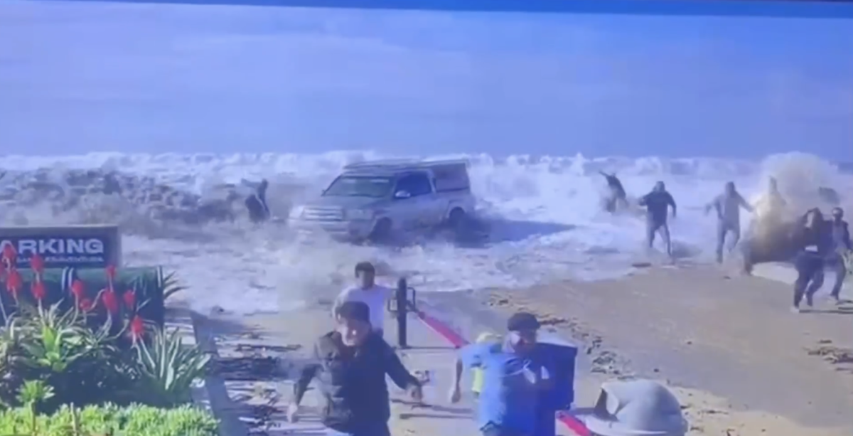 Watch a Huge Rogue Wave Wipe Out a Truck and Innocent Bystanders - Surfer