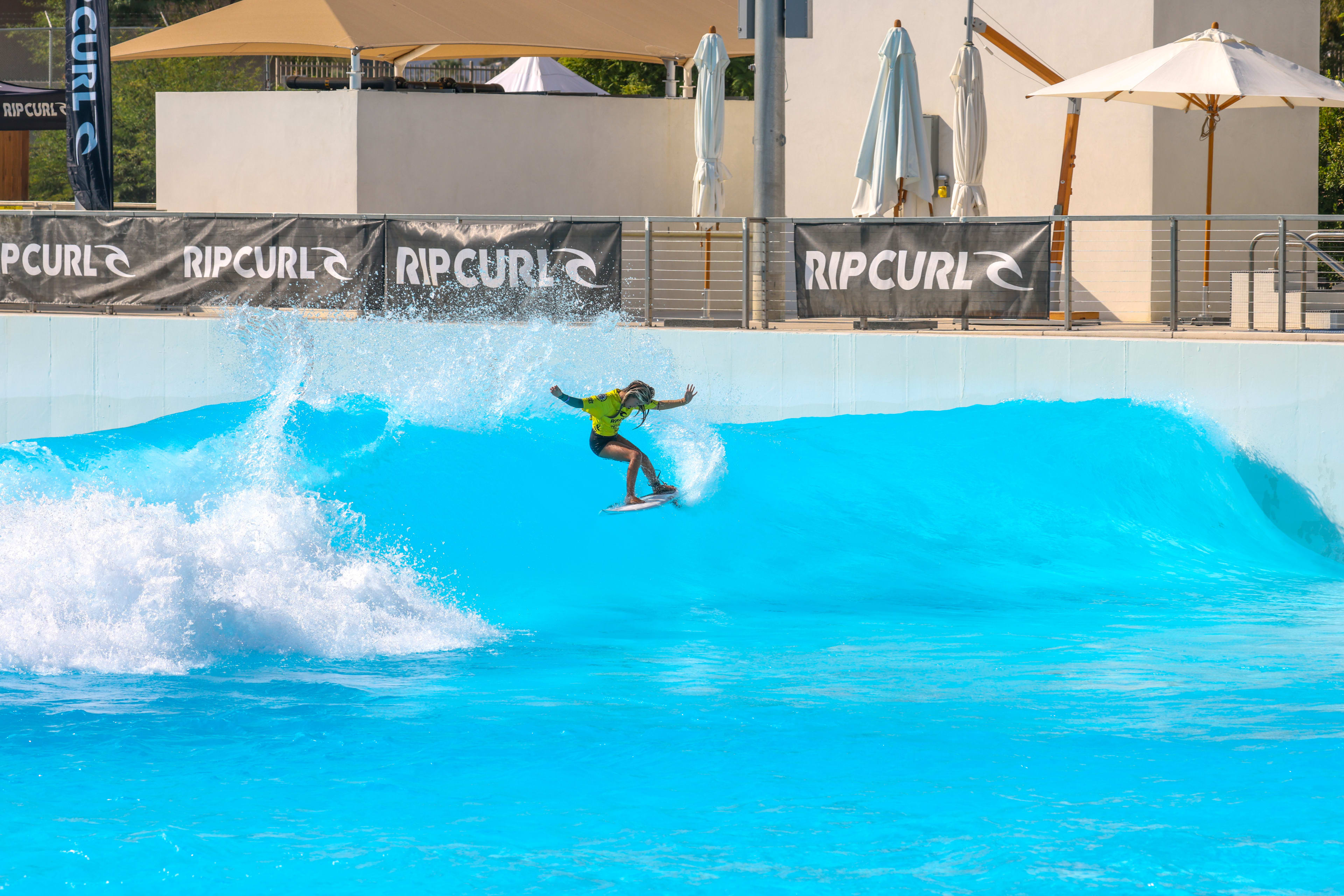 Zoey Kaina surfs a left at the Palm Springs Surf Club during the 2024 Rip Curl GromSearch National Final.